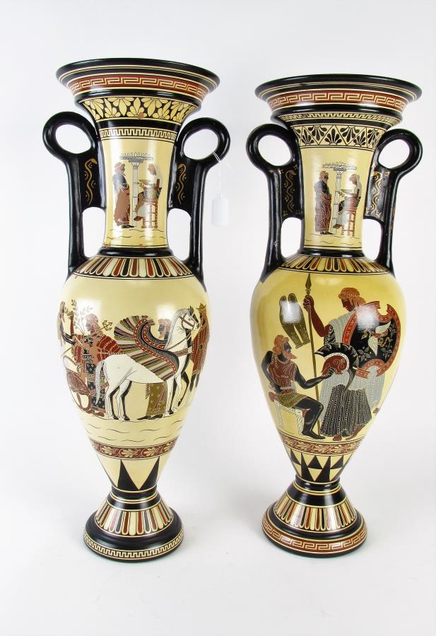 Pair of Leon Pessah Mythological Urns: A pair of mythological double handled urns including by Leon Pessah "Thetis & Ifaistos" (Hephaestus) and "Achilleus' Chariot and Minerva", each 26" high, honey colored ground with black, gold and deep