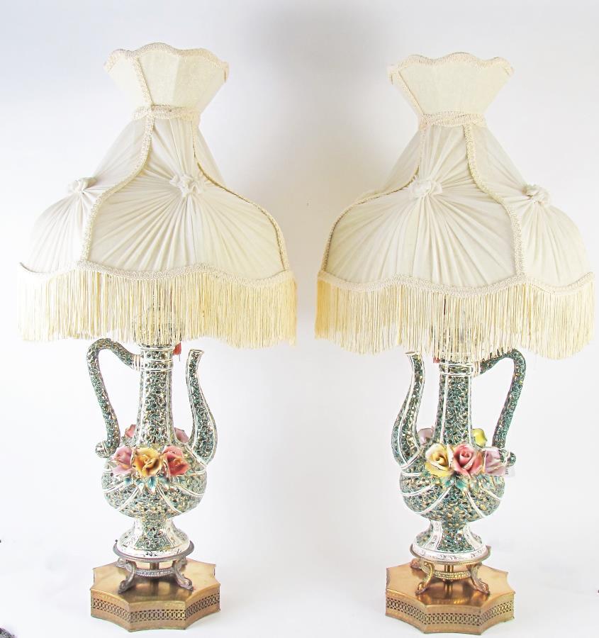 Pair of Italian Porcelain Teapot Lamps: A pair of Italian porcelain teapot lamps with pierced porcelain tea pot formed bodies, red and yellow applied porcelain decoration, on pierced cast metal bases, cream silk shades with fringe, 37.5" hi