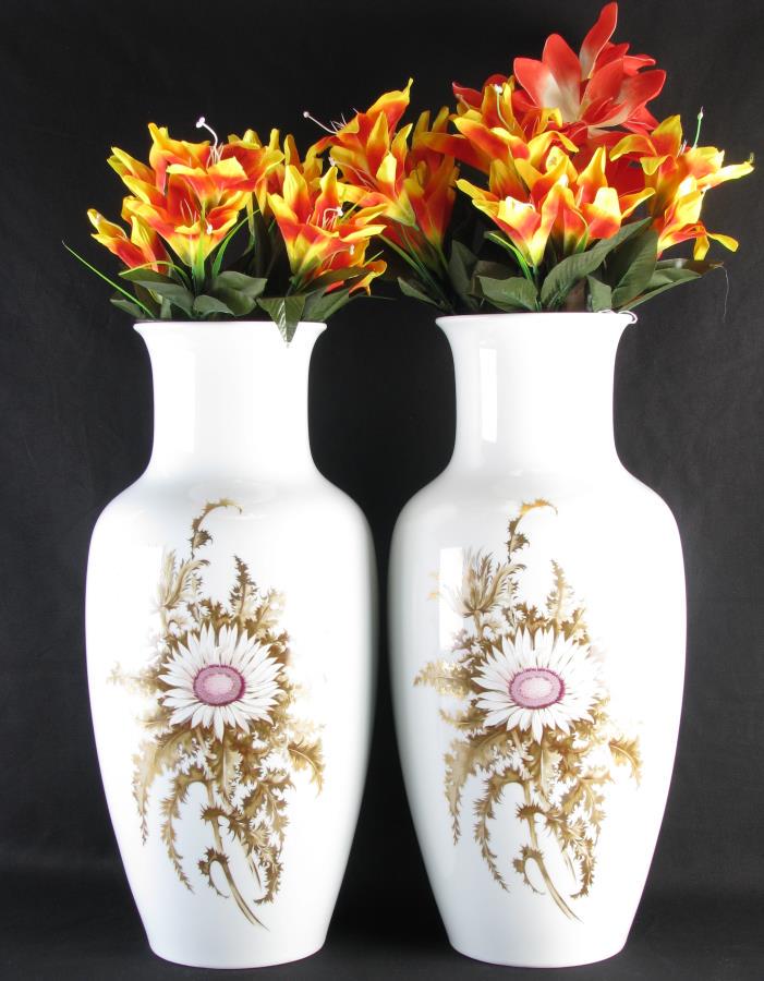 Pair of Kaiser Porcelain Vases: Pair of Kaiser Porcelain Vases, white vases with hand painted blooming thistle decoration, Schumm plastic inserts hold bouquet of artificial flowers, marked on bottom "Kaiser, Germany, Silberdistel", 