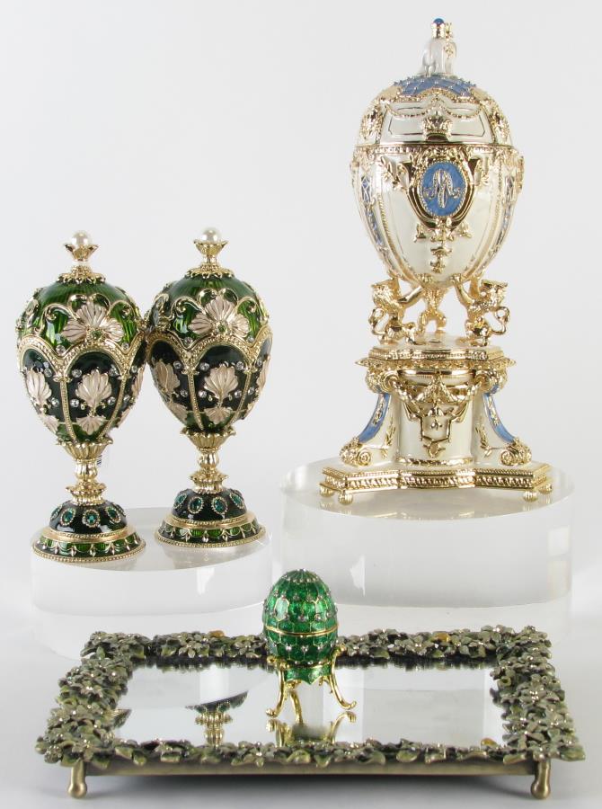 Jeweled and Enameled Dresser Accessories: Jeweled and enameled dresser accessories including a Jay Strongwater STYLE jeweled and enameled mirrored tray; a pair of green egg dresser boxes on round stands; a green enameled egg form dresser box 