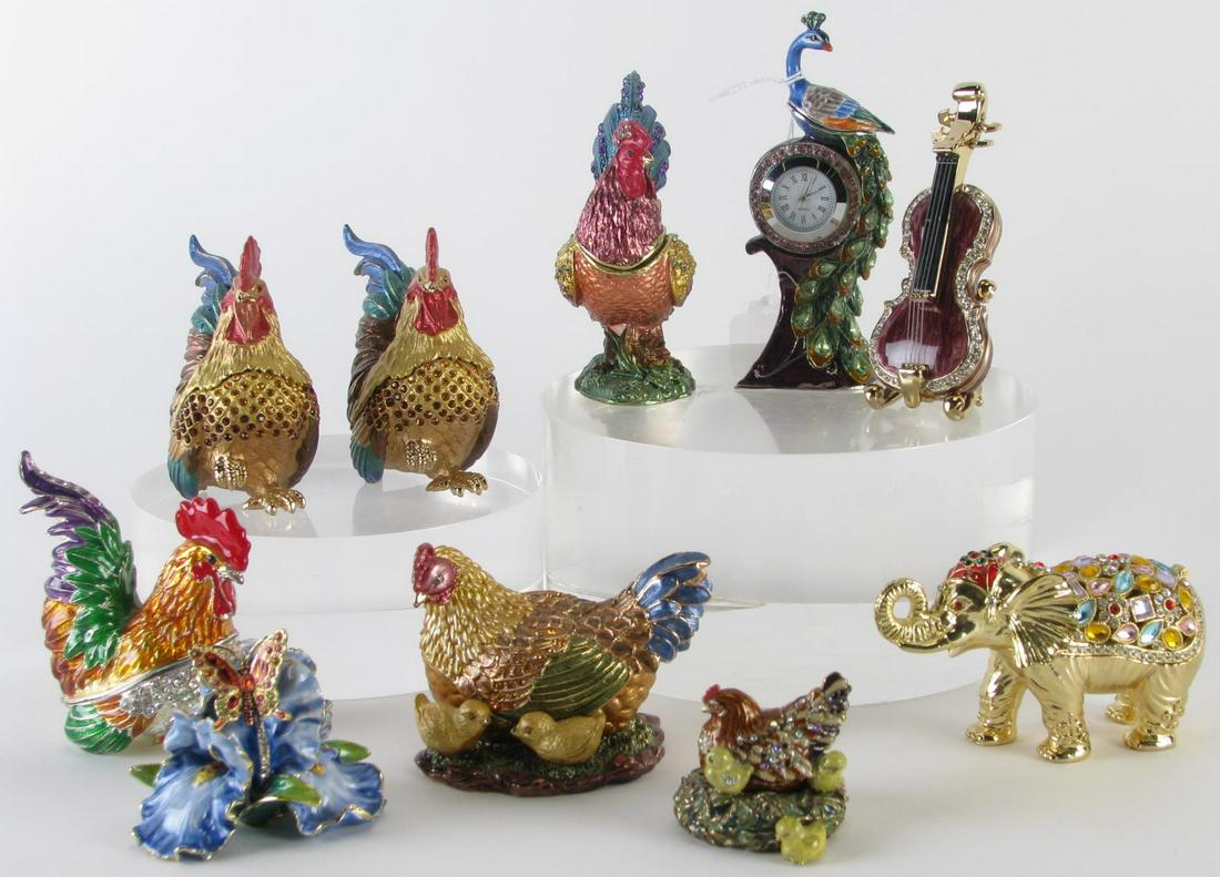 Ten Jeweled and Enameled Dresser Boxes: Ten jeweled and enameled dresser boxes including four roosters; two with hen and chicks; an elephant; a butterfly in flower; violin with stand; and peacock with clock; 1.5" h to 4.5" h