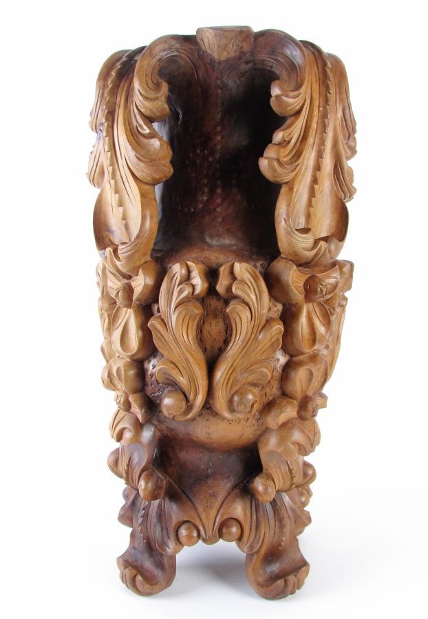 Carved Wood Floor Vase: A carved wood floor vase with floral and scroll open decoration, carved from a single piece of wood, 26" high