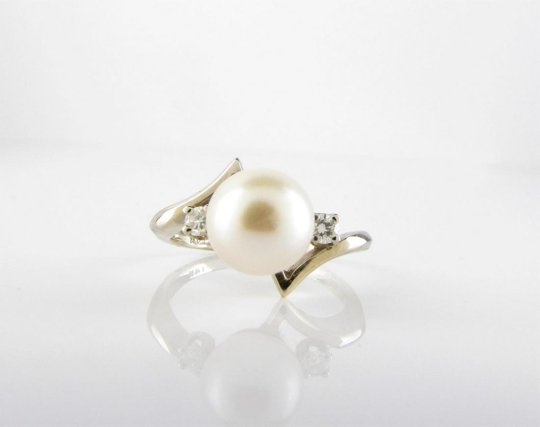 14K YG Ring, Akoya Pearl: 14k white gold ladyÂ’s ring containing one 7.5-8.0mm round white Akoya cultured pearl, AA quality, accented by two Â– 2.3mm round brilliant diamonds, SI2 in clarity, G/H in color, weighing appro