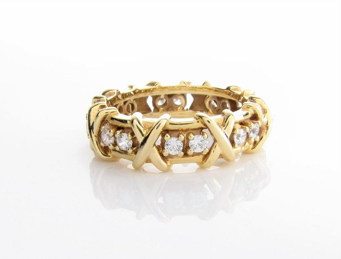 14K Yellow Gold Diamond Band Ring: 14K Yellow Gold Diamond X-O band in Tiffany & Co. Schlumberger style, containing sixteen round brilliant cut diamonds, each approximately .03ct equaling approximately .50ct tw, of SI clarity and G-H c