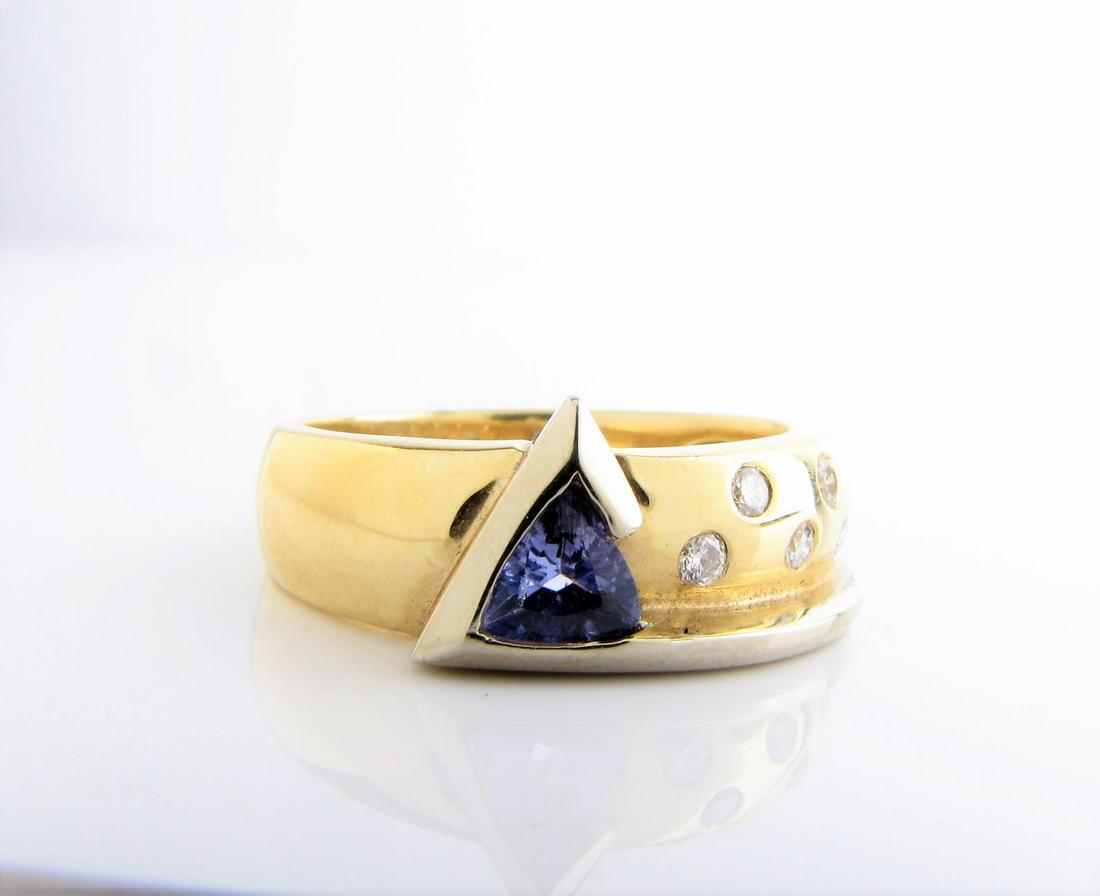 14K Tanzanite, Diamond Ring: 14k two tone lady's ring with one 4.5mm trillion shaped tanzanite, A quality, accented by nine 1.7-1.8mm flush set round brilliant diamonds, SI1 in clarity, G/H in color, weighing approximately 0.23ct