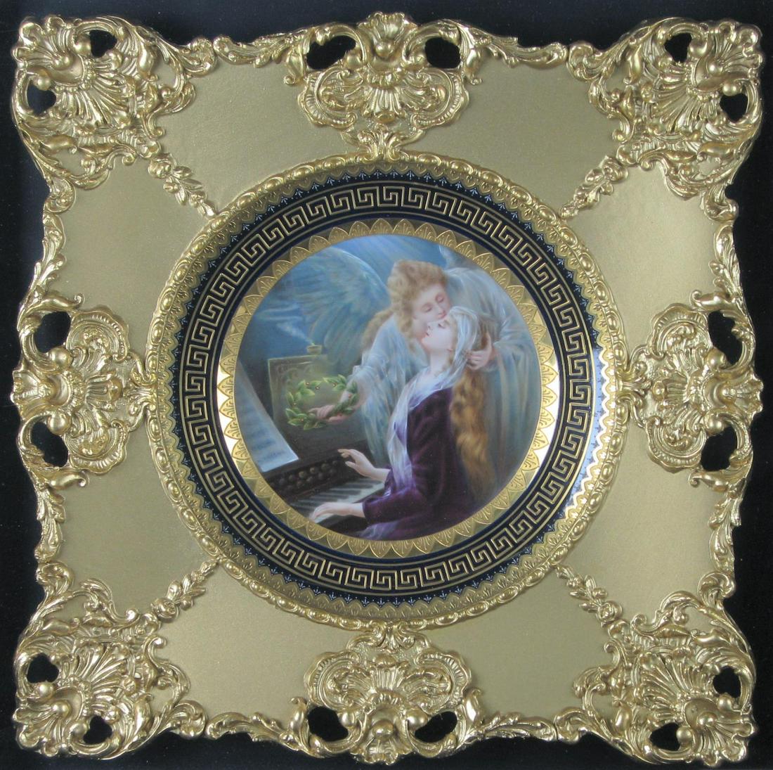 Royal Vienna Framed Porcelain Plate: Royal Vienna Framed Porcelain Plate, hand painted and enameled plate depicting a maiden at the piano being visited by an angel, gold Greek key decorated edge, in gold gilt frame and displayed in shado