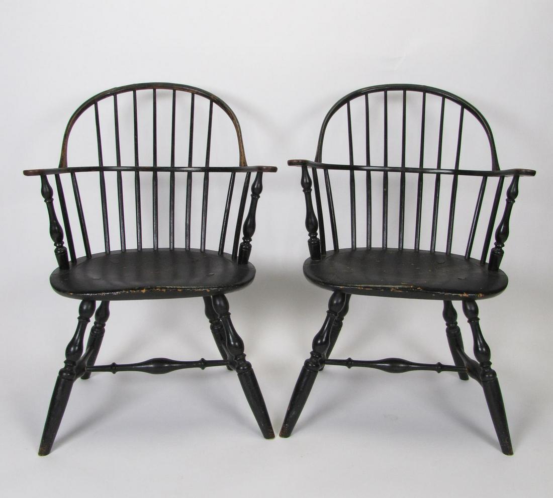 Pr of 18th Century Windsor Armchairs, Philadelphia: A pair of 18th century bowback Windsor armchairs, early black painted finish, H stretchers, carved saddle seats, 17.5" seat height, 36.5" overall height, believed to be, Joseph Henzey, Philadelphia, c