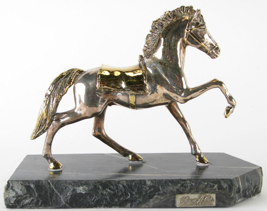 Yaacov Heller Sterling "The Thoroughbred": Yaacov Heller Sterling "The Thoroughbred", depicting standing horse with golden saddle, on black marble plinth, hand signed by artist on side of saddle, 9.5" x 3.75" x 7.25" high