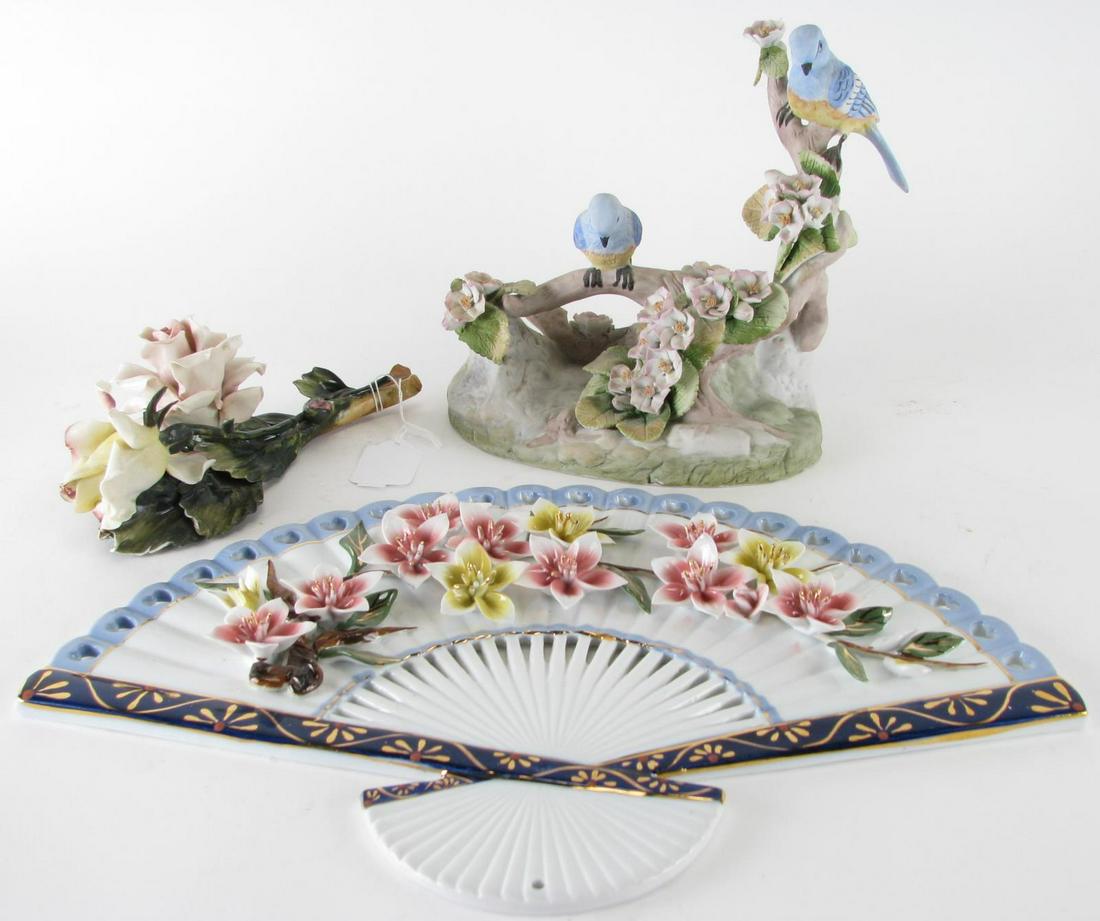 Three Decorative Porcelain Items: Three Decorative Porcelain Items, oriental fan with applied red and yellow floral decoration; bird grouping depicting two blue birds perched on flowering limbs, hallmarked on underside; Capodimonte fl