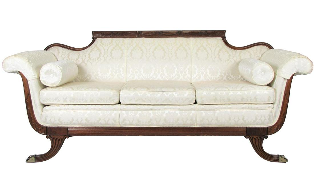 Duncan Phyfe Style Sofa: A Duncan Phyfe, period-style sofa, with carved frame, brass foot caps, tone on tone customer upholstery by Coffey's Custom Upholstery Mfg., New Albany, IN, arm caps and accent pillows, 82"l