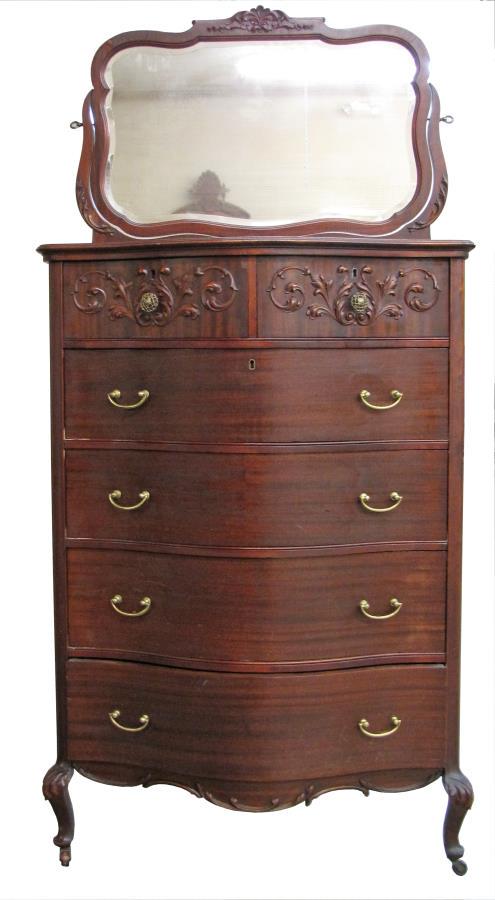 Serpentine Front Chest and Mirror: A serpentine front chest with mirror, applied carvings, four full drawers and two half drawers, beveled glass, on legs and wood casters, ca mid 20th century, 34 x 22 x 73"h