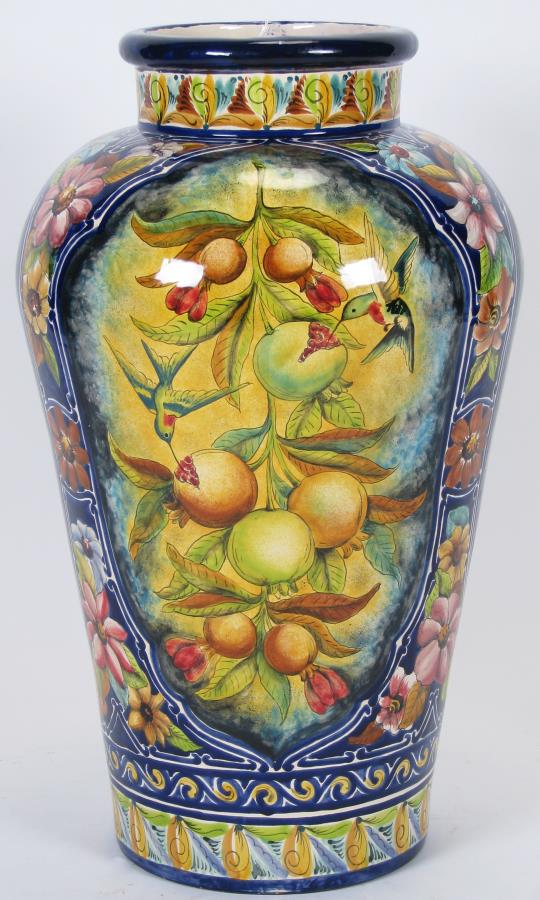 Mexican Mayolka Pottery Floor Vase: Mexican Mayolka Pottery Floor Vase, cobalt blue vase with fruit and hummingbird decorated panels, red blue and brown floral decoration, signed on underside "Mayolka, STA Rosa, Gto Mex", 30.5" high