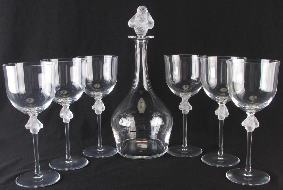 Lalique 'Roxane' Crystal Decanter Set: Lalique 'Roxane' Crystal Decanter Set, clear decanter with frosted figural stopper, with original fitted foam box (decanter only); set of six matching wine glasses, clear cups with frosted figural dec