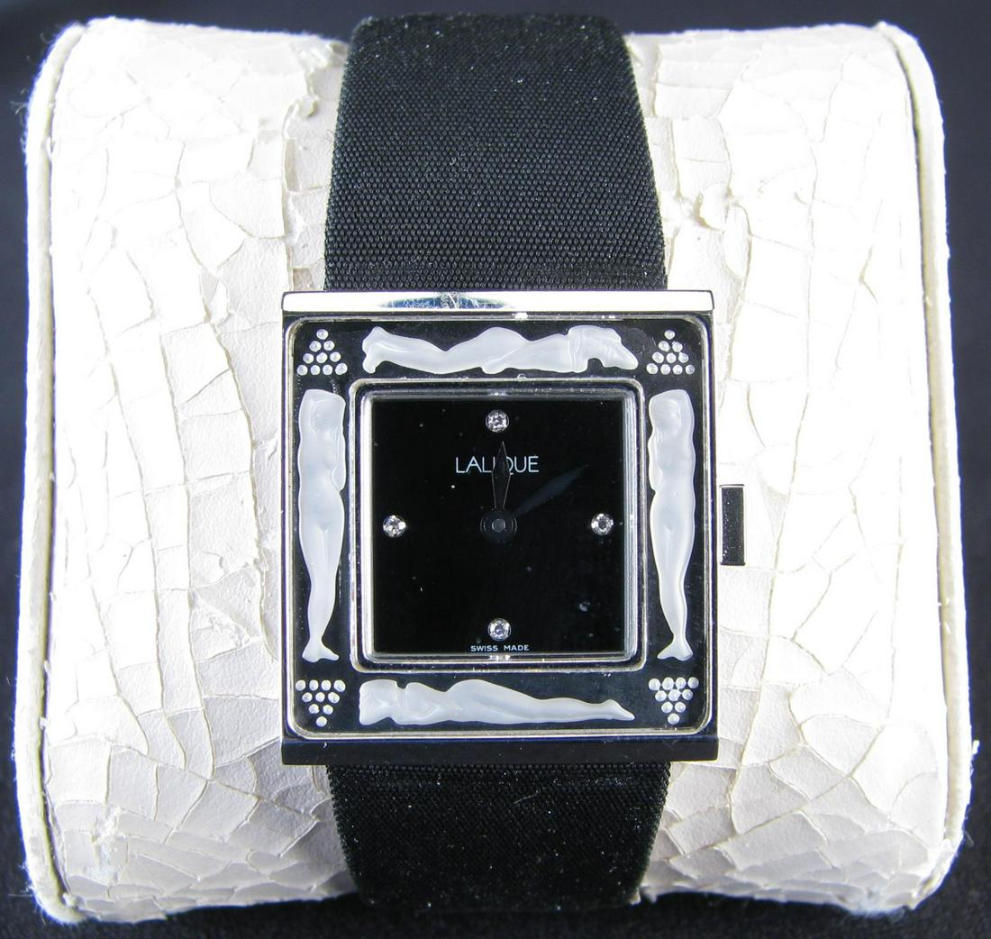 Lalique Wristwatch in Box: Stainless Steel watch, Bacchantes pattern By Lalique.Â Mother of Pearl face with FourÂ single cut round Diamonds at 12, 3, 6 and 9 oÂ’clock. The face is surrounded by nudes on crystal plaques