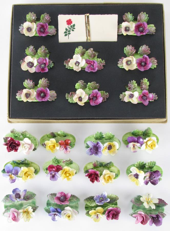20 Crown Staffordshire Place Card Holders: 20 Crown Staffordshire Place Card Holders including: set of eight; set of four; cased set of eight with place cards and display box, all hallmarked on underside, 2"-2.25" long