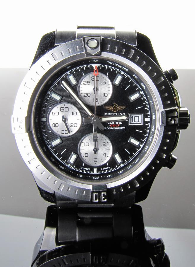 New Breitling Colt Chronograph Watch: A new Breitling Colt chronograph watch with stainless steel link bracelet, automatic movement, date window, black dial with silver tone subdials, includes box and papers; with manufacturer's 2-year wa