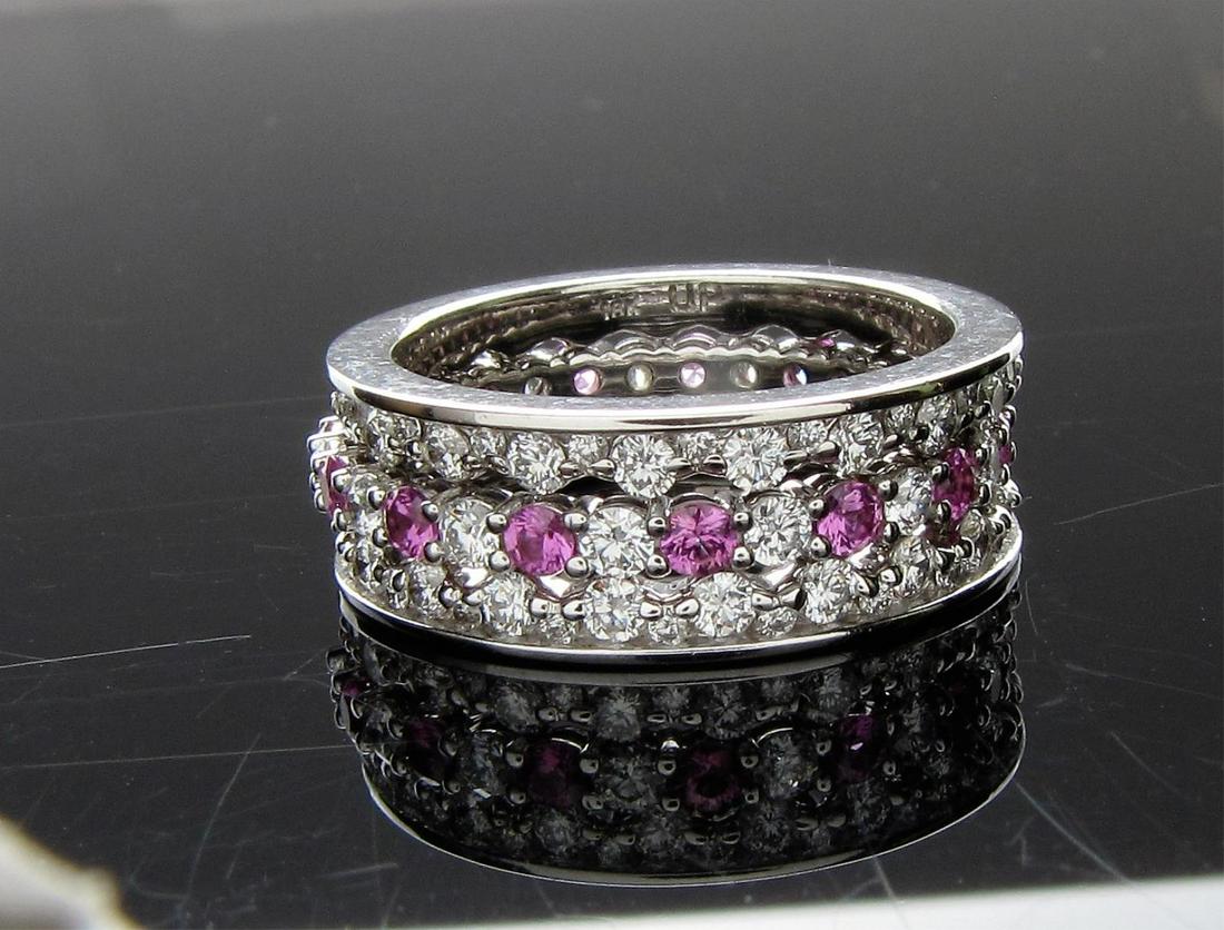 Tiffany & Co. Diamond and Pink Sapphire Stack Ring: A Tiffany & Co. platinum band ring with alternating diamond and pink sapphires, size 7; flanked with two 18K white gold, matching crown style diamond bands, size 6.75; three band rings total (only the
