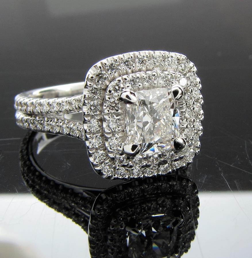 18K White Gold Michael M Fashion Ring: An 18K white gold fashion ring designed by Michael M, containing a center, cushion cut diamond, .78ct, G color, SI2 clarity; mounting contains an additional .68ctw diamonds in double halo and in split