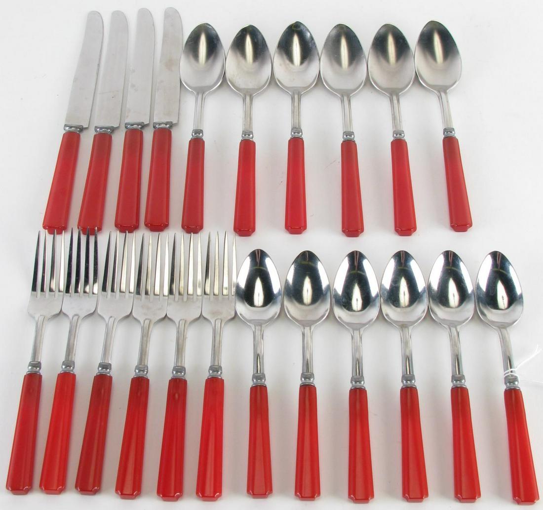 Molly Pitcher Stainless and Bakelite Flatware: Molly Pitcher Stainless and Bakelite Flatware, 22 pieces including: (6) forks; (6) tablespoons; (6) teaspoons; four knives; stainless steel with red Bakelite handles; 6.75"-9" long