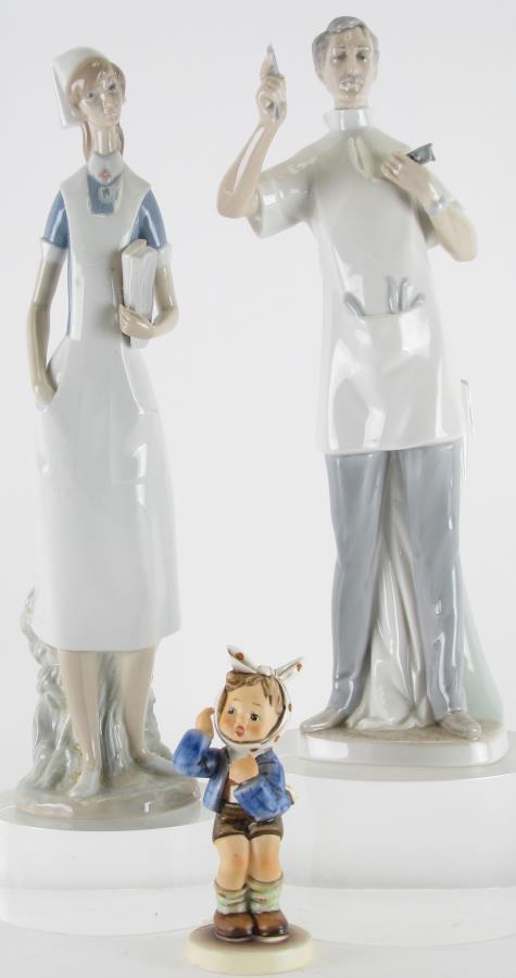 Three Lladro and Goebel Porcelain Figures: Three Lladro and Goebel Porcelain Figures, Lladro "Dentist" #4762, artist Salvador Furio, issued in 1971 and retired 1978, no box; Lladro "Nurse" #4603, artist Salvador Furio, issued 1970 and retired