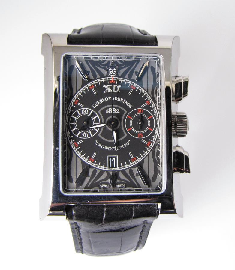 Like New Cuervo Y Sobrinos Wristwatch: A like new Cuervo y Sobrinos 1882 Chronograph Esplendidos wristwatch with humidor box and papers, black and gray jungle pattern dial, date at 6 o'clock, second hand sub-dial at 9 o'clock, 30-second co