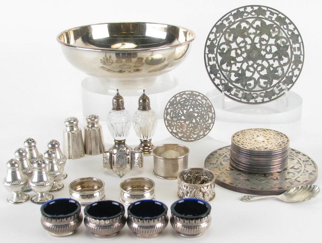 Collection of Sterling Tableware: Collection of Sterling Tableware, including: bowl; five English sterling napkin rings; four pair of salt & pepper shakers; set of four salt dips with cobalt glass inserts; shell spoon; pair of weighte