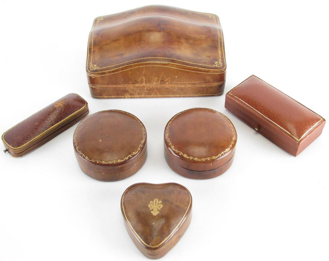 Group of Six Leather Dresser Boxes: Group of Six Leather Dresser Boxes, one rectangular with gold decoration; two round with gold decoration; heart shaped with gold decoration; English Handcock's & Co. pin box; Thomas Worldy pin box; 2.