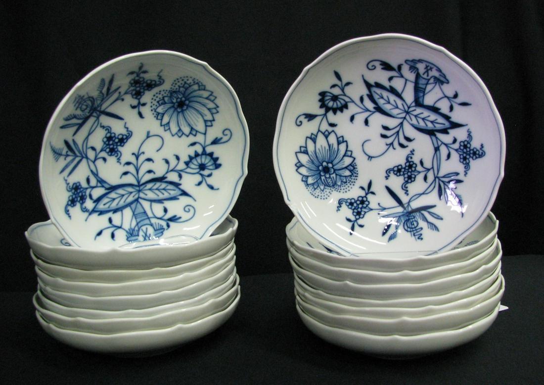 Sixteen Meissen Blue Onion Berry Bowls: Sixteen Meissen Blue Onion berry bowls, 5.5" diameter, 1.25" deep, six have chips on rim, slight variations in design and in crossed swords marks, indicating different manufacturers and/or age