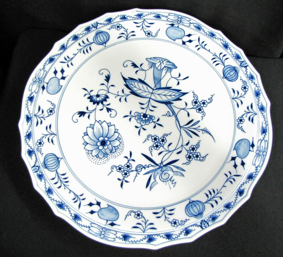 Meissen Blue Onion Pedestal Cake Plate: A Meissen Blue Onion pedestal cake plate, 14.5" diameter with scalloped edge, 4.5" high, platter with crossed swords mark and blue number 43 and incised 329 and 334, base with slightly different cross