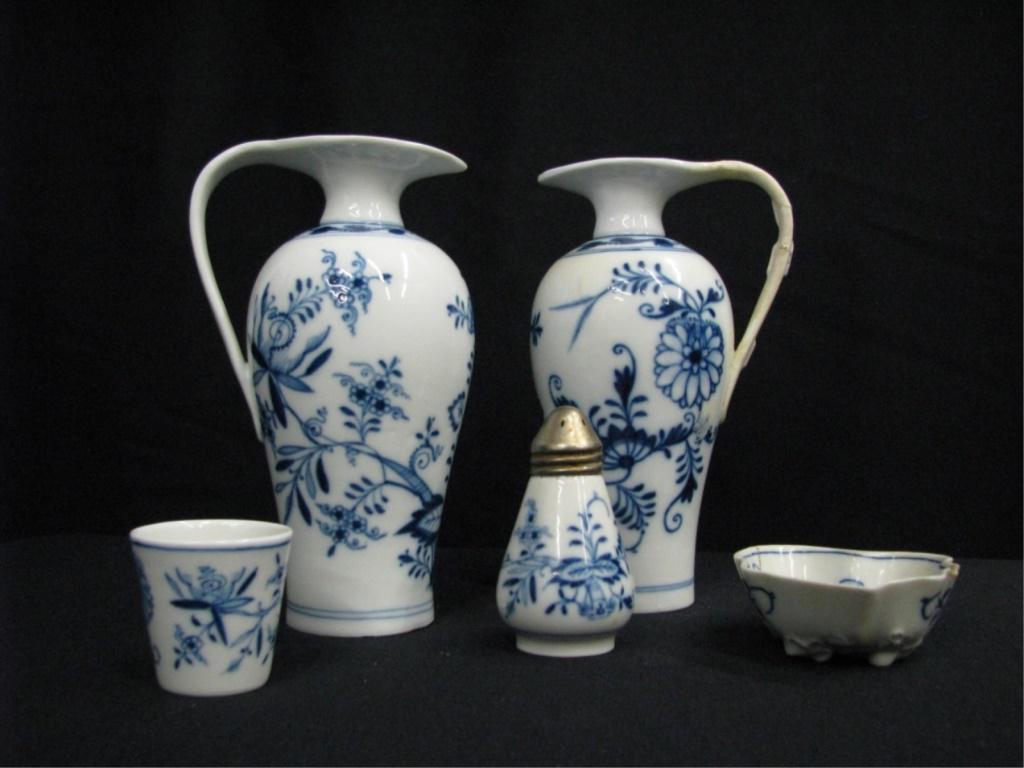 Meissen Blue Onion Porcelain Grouping: Meissen Blue Onion porcelain group including a cordial, a salt shaker, two 6.5" cruets (one with poorly repaired handle, no stoppers), and one damaged nut dish