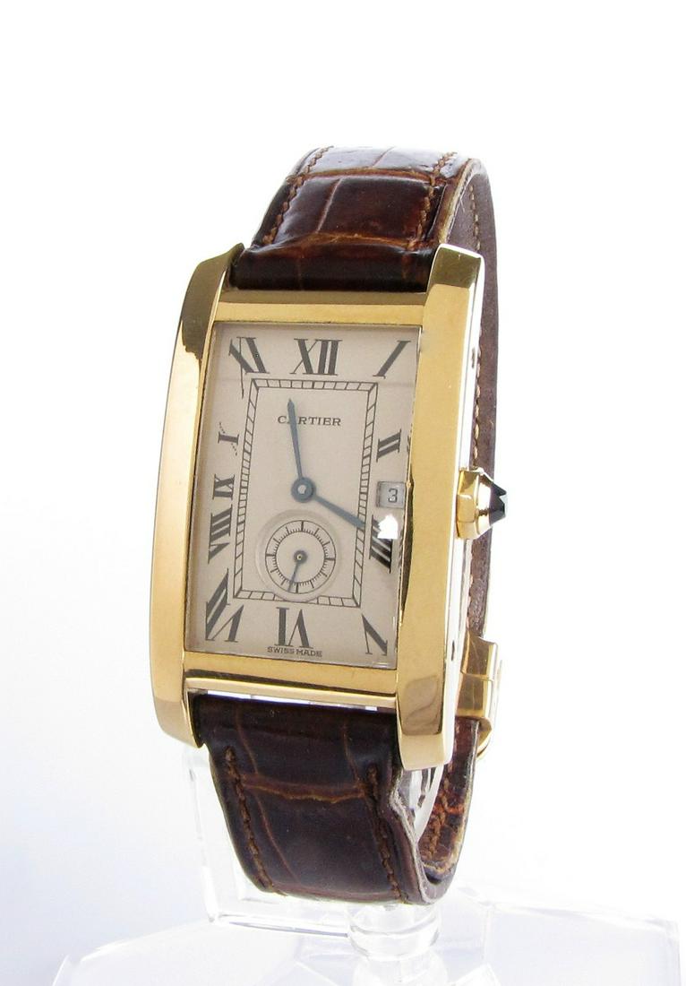 Gentleman's 18K Cartier Americaine Tank Watch: A gentleman's Cartier Americaine tank style quartz watch (model #811904, not as listed on appraisal) with 40mm x 23mm silver dial, 18K fixed bezel, blued steel hands, Roman numeral markers, one sub-di