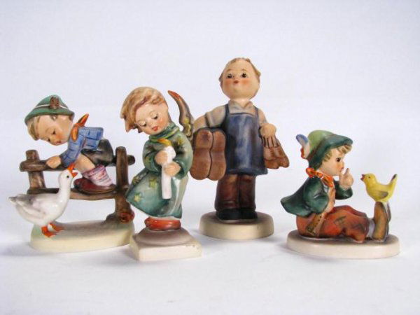 Four Goebel Hummel Figurines: Four Goebel Hummel Figurines including "Heavenly Angel" (crazing - see photo), 21/0, 4" tall, "Singing Lesson", 63, 3" tall, "Barnyard Hero", 195 2/0, 4.125" tall and "Boots", 143/0, 5.25" tall, no bo