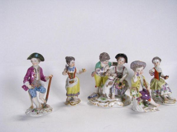 Group Of Meissen Porcelain Figurines: Group Of Meissen Porcelain Figurines, five pieces including one grouping depicting couple with dog, 4.5" - 5.5" tall, all with blue cross swords mark, flower damage on boy with shovel (see photo)