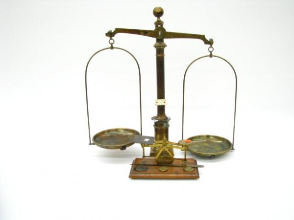 Two Antique Brass Scales: Two antique brass scales including platform scale with two one ounce and one two ounce weights, and brass beam scale with dial indicator