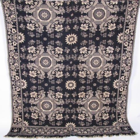 Blue and White Jacquard Coverlet, 1855: Blue and white Jacquard coverlet, full size, with school house and flower planter border, 8 point star corner blocks, dated 1855, tag indicates possible weaver as Sarah LaTourette, 1822-1914,