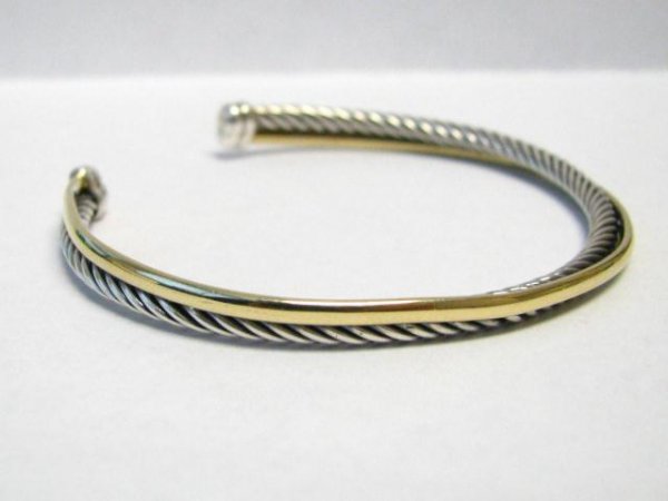 David Yurman Sterling, 18K Cuff Bracelet: David Yurman Sterling Silver and 18K yellow bonded gold crossover cuff bracelet