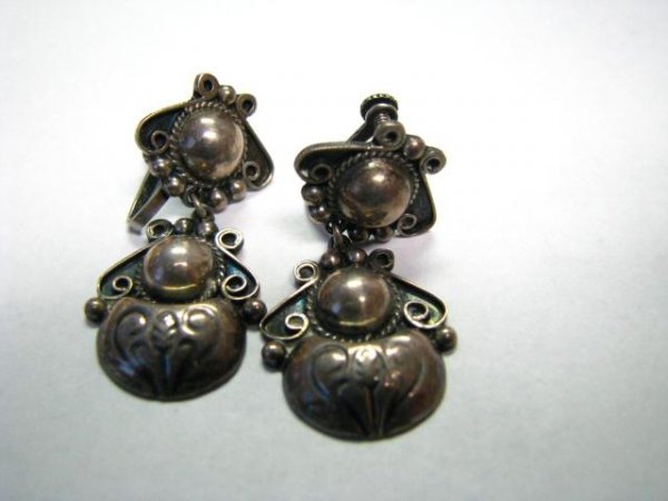 Group of Southwest and Mexican Silver Jewelry: Group of southwestern, native American, and Mexican silver jewelry, including Alpaca Mexico pill box with abalone insert, jacket pin with jade, pair of earrings, six button covers, pair of
