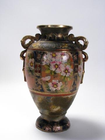 Japanese Earthenware handled urn: Japanese earthenware handled urn, circa mid 20th century, marked "made in Japan", 15.5" high, with leaf and floral motif painted decoration