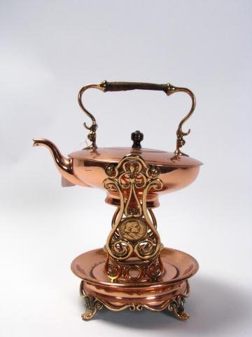 1892/1893 Columbian Expo Brass & Copper Server: Columbian Exposition World's Fair brass and copper tea kettle, with sterno-type heating base, supports embossed with Christopher Columbus medallions, 12.5" high, significant wear on wooden