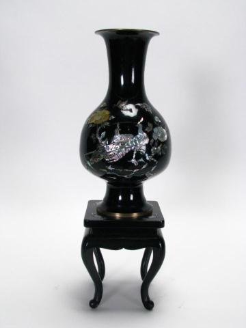 Brass and Enameled Oriental Vase: Brass and enameled Oriental vase with inlaid abalone and mother of pearl in bird and floral motif, with wooden pedestal, 19 inches high