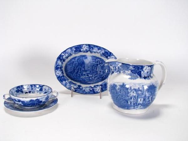 Wood & Sons Pitcher, Bowls, Saucer, Flow blue: Four items of Wood & Sons Woods Ware, Enoch Wood, English Scenery Flow Blue pottery including 5.75" tall pitcher, two-handled 4.75" bowl and 6" saucer, and 8.75" x 6.75" oval vegetable bowl