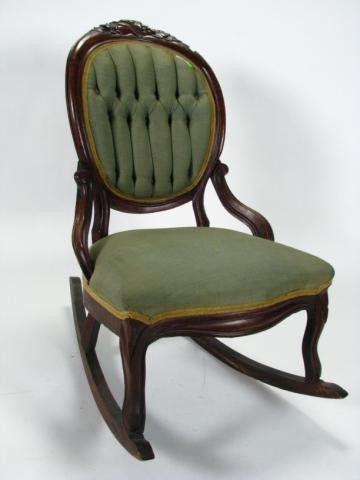 Victorian Cameo Back Rocking Chair: Victorian cameo back rocking chair with nut and leaf carvings, hip rests, upholstered back and seat