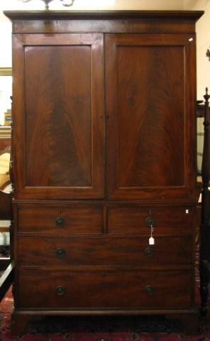 Antique English Mahogany Armoire/Press: Antique English Mahogany Armoire/Linen Press, two piece construction with four drawer base, having bracket foot, paneled door top with four sliding shelves on interior (one needs repair and one is