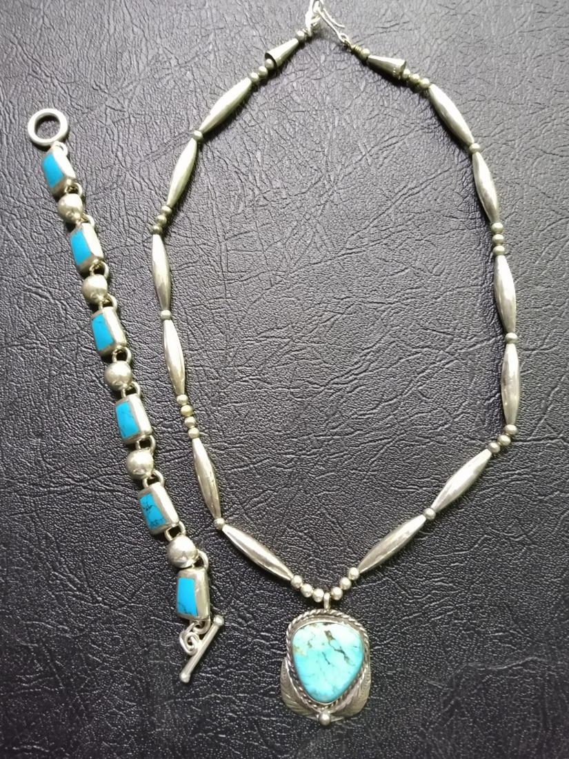 Southwest/Native American Necklace, Bracelet: A southwest/Native American silver necklace, 18" long featuring pendant with triangular turquoise; and 8" bracelet with turquoise links, marked Mexico, .925