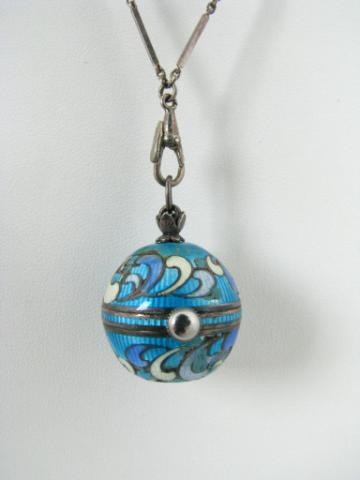 Lady's Ball Motif Enameled Silver Watch Pendant: Lady's antique style ball motif watch pendant and .800 silver chain, 22mm silver ball adorned with blue and white enamel inlay, 10mm round white dial has black Arabic numerals, appraised in 1997 for $