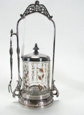 Antique Silverplate and Glass Pickle Caster Set: Meridian Silver Plate Co. Quadruple plate caster in bird and leaf motif, with glass pickle canister with decorated with enamel painted flowers, some chips on exterior of rim, with lid and tongs
