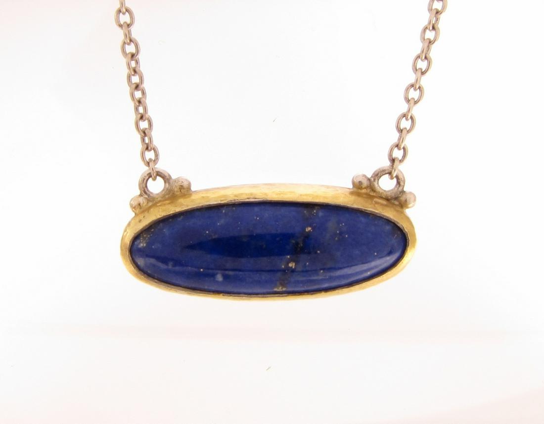 Gurhan Sterling, 24K Lapis Pendant: A Gurhan hammered sterling silver east-west pendant with an approximately 21mm x 8mm cabochon lapis, 24K bezel, attached to a 17" sterling silver Gurhan link chain