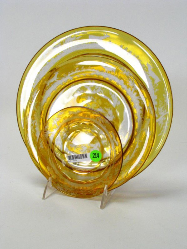 Amber Bohemian Glass Dinnerware: Amber cut to clear Bohemian glass dinner service with deer and forest motif including thirteen 10.75" dinner plates, thirteen 8.75" salad plates and twelve 6" shallow bowls