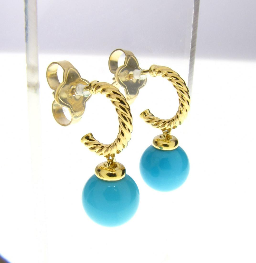 David Yurman Turquoise Hoop Earrings: A pair of 18K yellow gold Cable hoop with turquoise drop earrings by David Yurman. .88" long, 9.5mm turquoise.