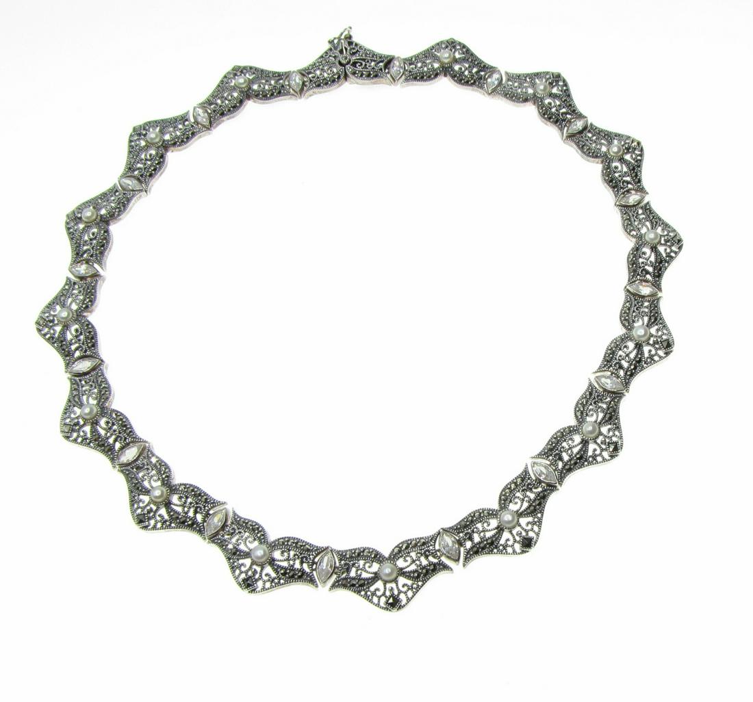 Judith Jack Sterling, Marcasite and Pearl Necklace: A Judith Jack sterling silver, 16" long necklace with filigree, milgrain and diamond cut design, sixteen marquis marcasite stones and fifteen 4mm pearls.